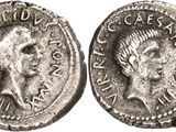 a silver coin with an image of a man ' s head on it