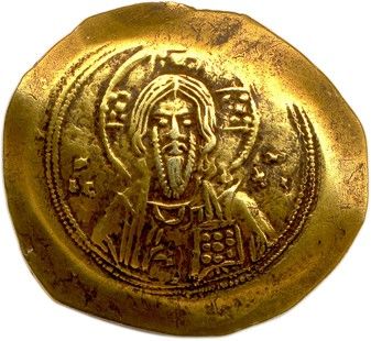un gros plan d'une pièce d'or sur laquelle figure l'effigie de Jésus