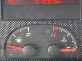 a digital clock on the dashboard of a car