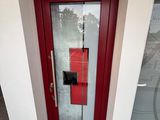 an image of a red door with a glass window