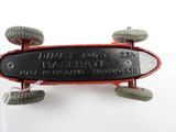 a red and black skateboard with wheels on a white surface