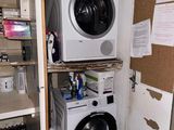 a washer and dryer in the corner of a room