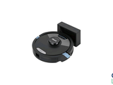 a black robot that is sitting on a white surface