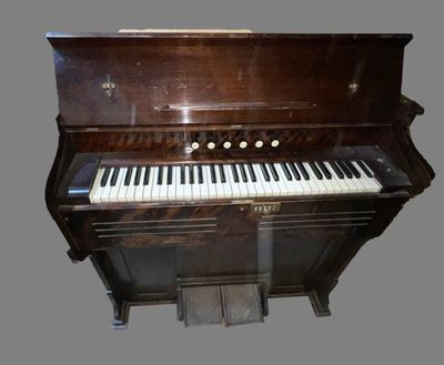 a piano that is sitting on the floor