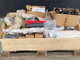 a wooden box filled with assorted items on a pallet
