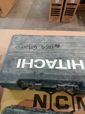 two suitcases that are sitting on top of a cardboard box