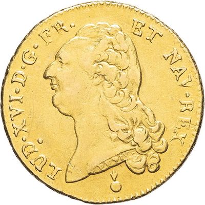 a close up of a gold coin with a woman ' s head on it