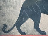a painting of a black cat on a wall