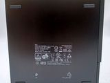 the back of a laptop with a black cover on a white surface