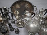 a lot of silver items that are on a table