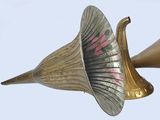 a brass trumpet with a pink flower on it