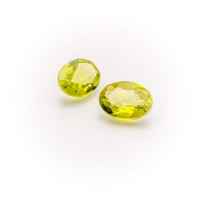 a pair of yellow sapphires on a white background
