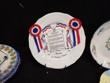 a plate with a certificate on it next to a plate with a ribbon