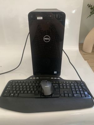 a desktop computer with a keyboard and mouse on a table