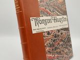 un livre marron avec une couverture marron et une couverture noire et rouge