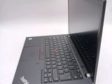 a laptop computer sitting on a white surface with a black keyboard