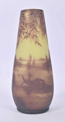 a vase that has a picture of a boat in the water