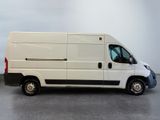 a white van that is parked in a room