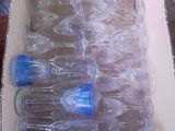 a box full of empty wine glasses sitting on a table