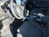the interior of a car with a steering wheel and a dashboard