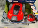 a red toy car in the box of a toy car