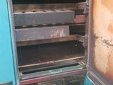 an old oven that is sitting in the back of a truck