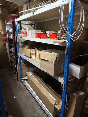 a room with a lot of boxes and boxes on the shelves