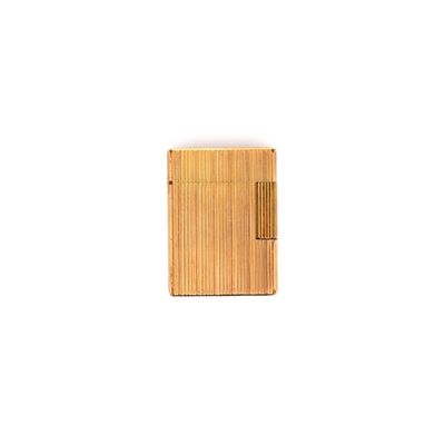 a small wooden object on a white surface