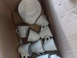 a lot of cups and saucers in a box