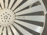 a close up of a metal chair with holes in it