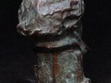 a bronze bust of a man on a pedestal