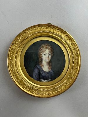 painting of a woman in a blue dress in a gold frame