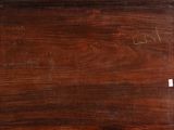 an old wooden box with writing on it sitting on top of a table
