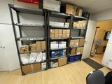 a room with a lot of boxes on the shelves