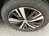 the tire of a car with a flat tire is shown