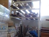 many rolls of paper on the shelves in the room
