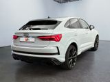 the rear end of a white audi qx parked in a garage