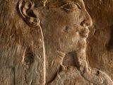 an image of a stone relief of a man and a woman