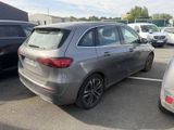 a silver car parked in a parking lot with other cars