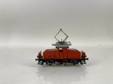 a toy train on a white surface with a white background