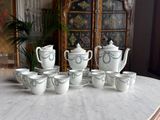 many cups and saucers sitting on a marble table