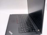 a black laptop with a black keyboard on a white surface