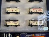 six train cars that are in a display case