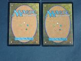 two decks of magic the gathering are shown on a table