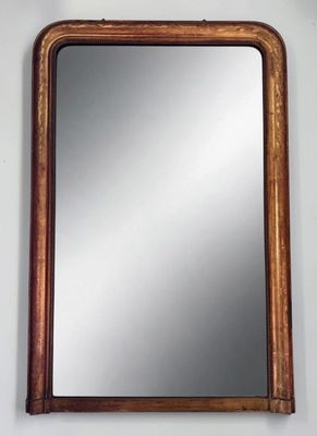 an image of a mirror hanging on a wall in a room