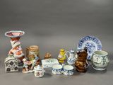 many different types of vases and bowls on the table
