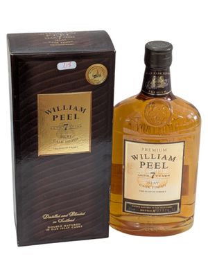 a bottle of william peel whisky next to a box