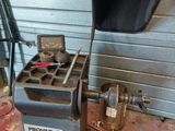 a machine that is sitting on the ground in the garage