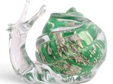 a glass snail that is sitting on top of a glass bowl