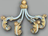 a gold and blue decorative object on a gray background